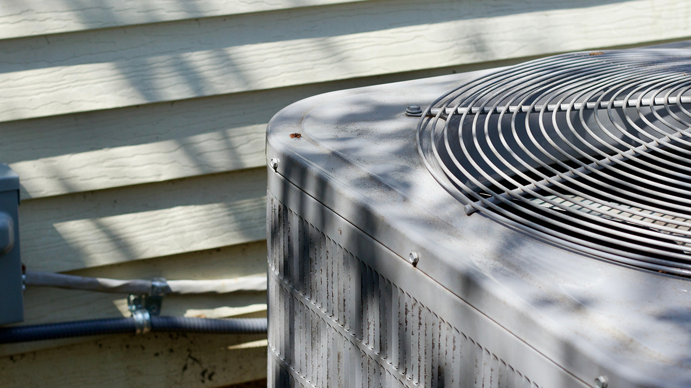 HVAC technicians replacing a unit