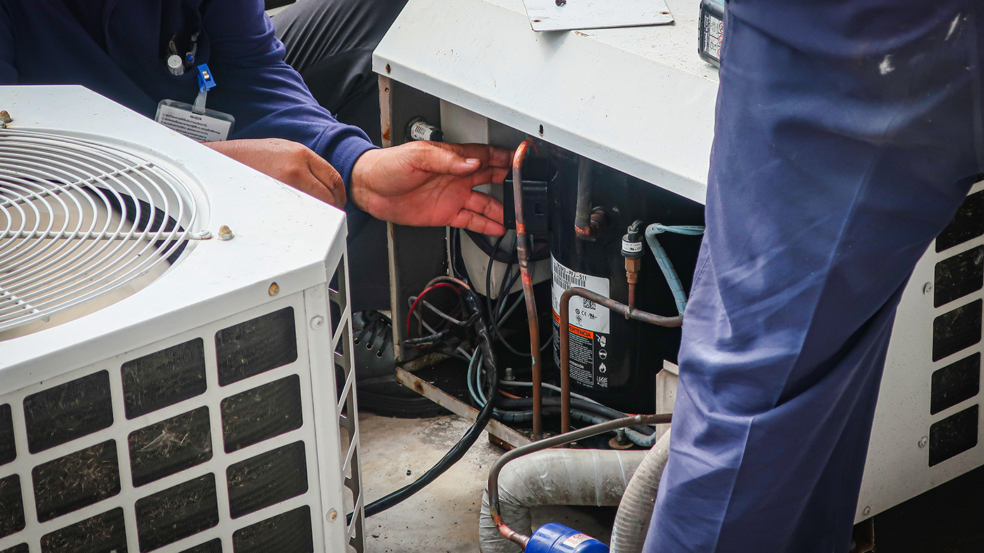 HVAC Service technician servicing a unit