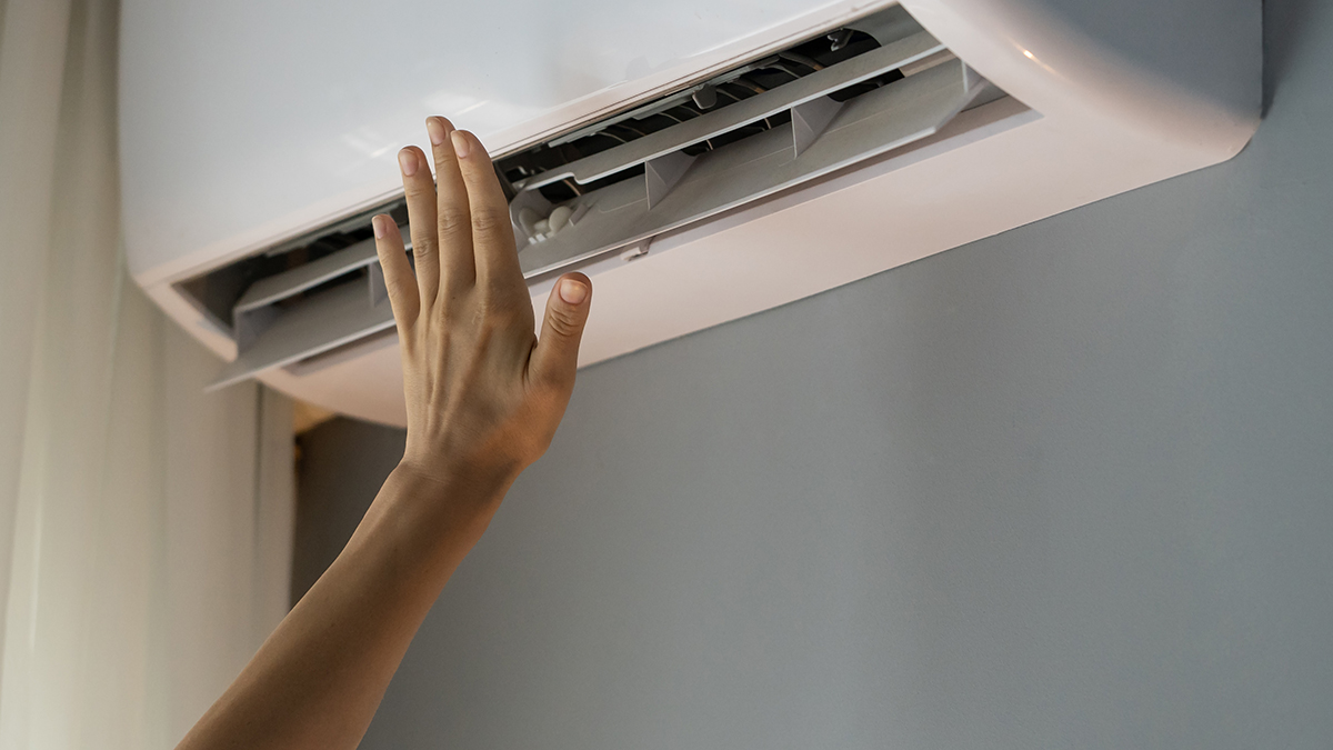 arm reaching to adjust ac