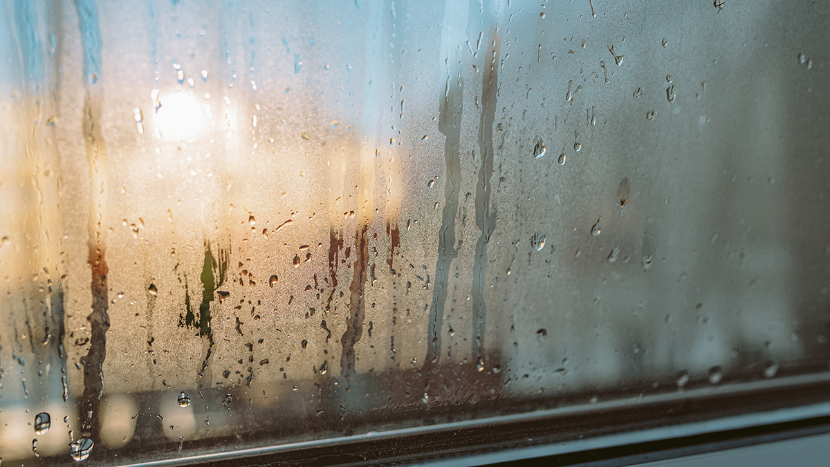 Morning Sunlight Through Water Droplets on The Window Desk