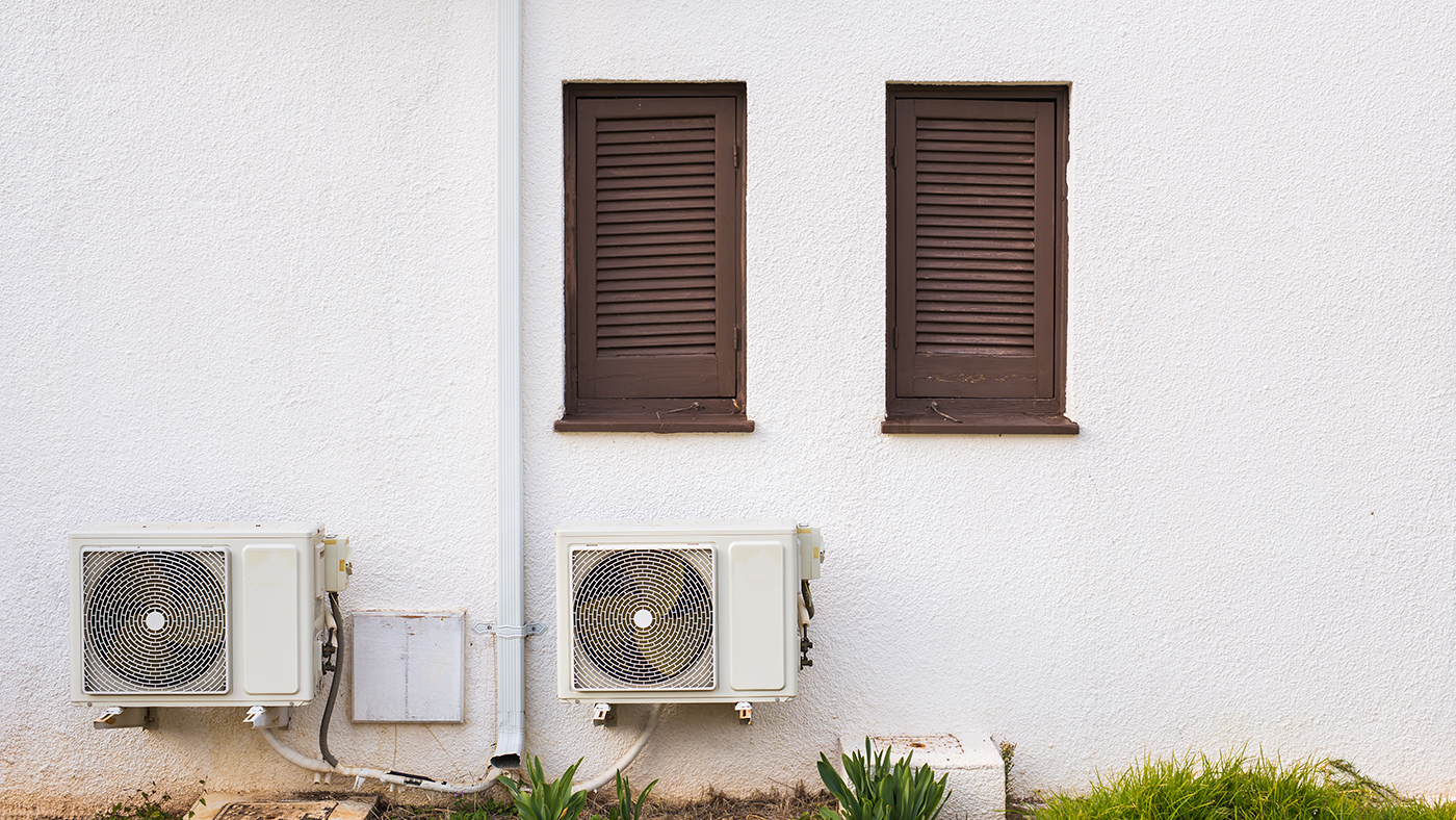 AC compressor installed on a building